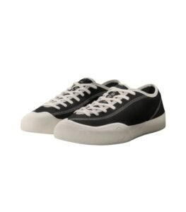 Minimal black and white Village PM sneakers with a clean silhouette and understated design