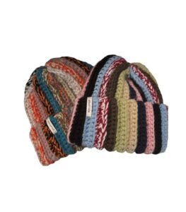 Handmade chunky knit beanie with a textured finish, worn as an everyday menswear accessory for cold weather outfits.