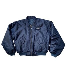 Vintage navy Schott bomber jacket with a classic silhouette, styled as a timeless outerwear piece for everyday menswear looks.