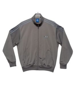 Vintage Adidas track jacket in classic sporty style, second hand with retro details