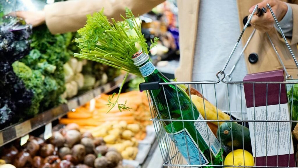 Shopping cart filled with fresh produce.